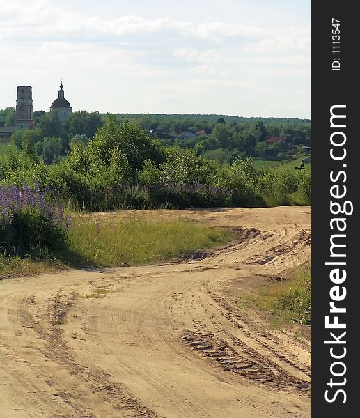 Road in village, aging church