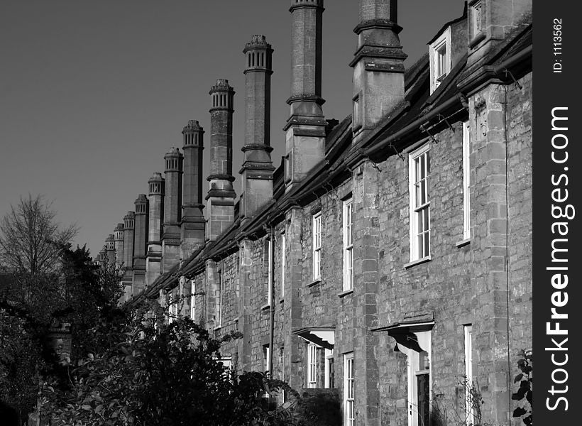 A cropped view of a row of mediaeval houses attached to Wells Cathedral in Wells, Somerset, England. A cropped view of a row of mediaeval houses attached to Wells Cathedral in Wells, Somerset, England