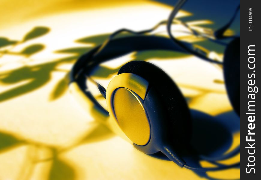 Headphones in blueand yellow colorl lighting