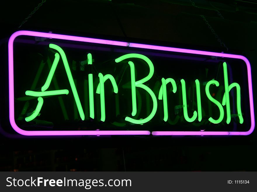 A neon sign with the words Air brush. A neon sign with the words Air brush