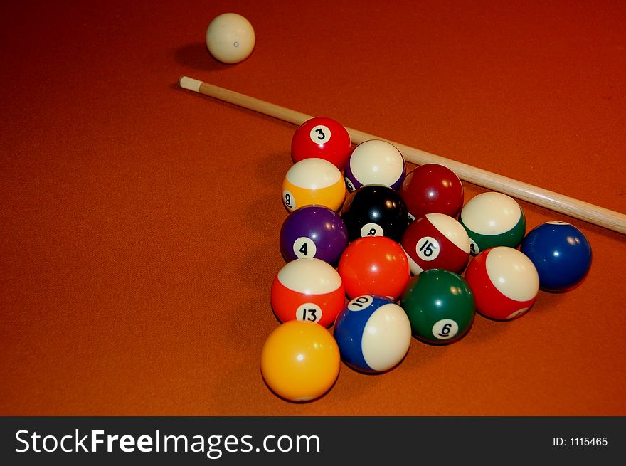 Orange background with pool balls cue and cue ball. Orange background with pool balls cue and cue ball.