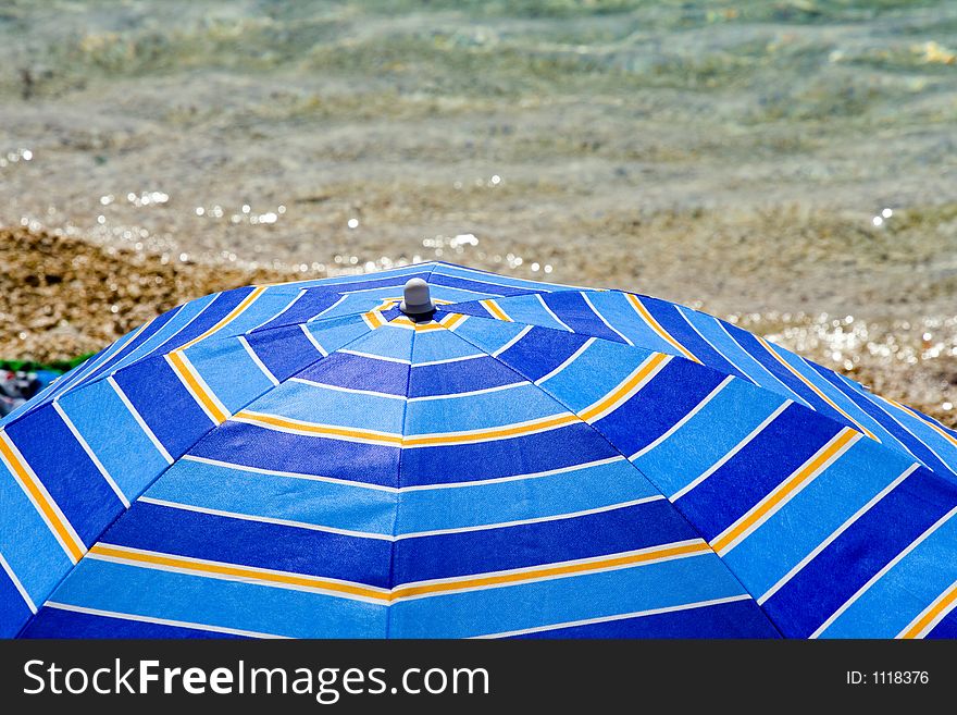 Summer umbrella and the sea
