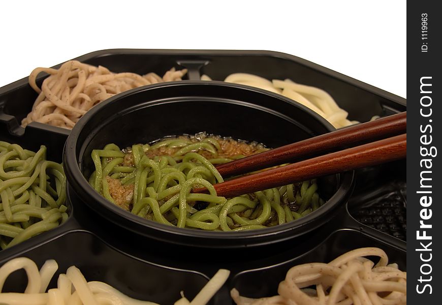 Extreme close-up of a soba lunch box with chopsticks. Clipping path included in the file. Extreme close-up of a soba lunch box with chopsticks. Clipping path included in the file.