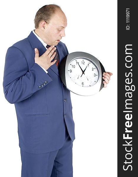 Businessman holding and looking at a clock. Businessman holding and looking at a clock