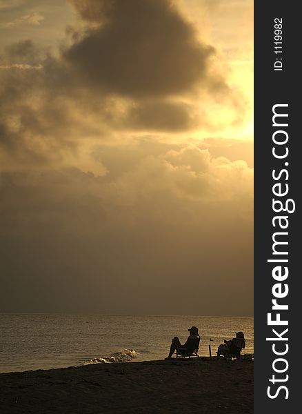 Couple on beach at sunset. Couple on beach at sunset