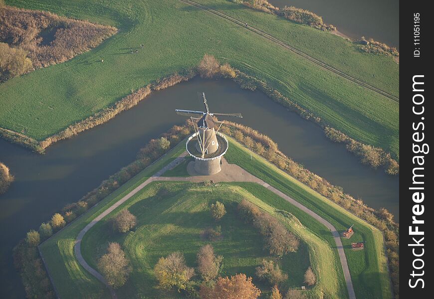 Grain mill named Nooit Volmaakt in the center of city Gorinchem in the Netherlands, picture taken from a hot air balloon