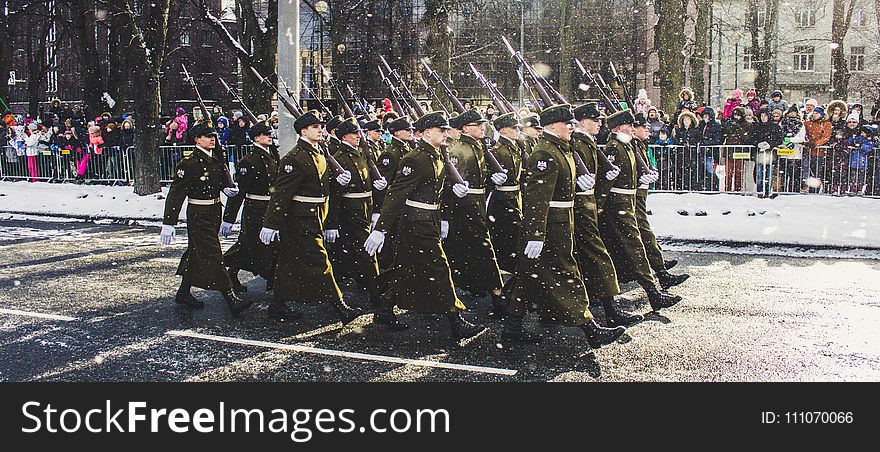 Group of Soldiers Parading on Concrete Road