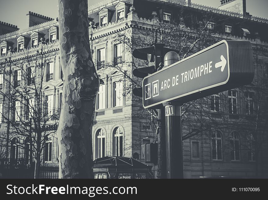 Grayscale Photo of Black and White Arc De Triomphe Street Sign