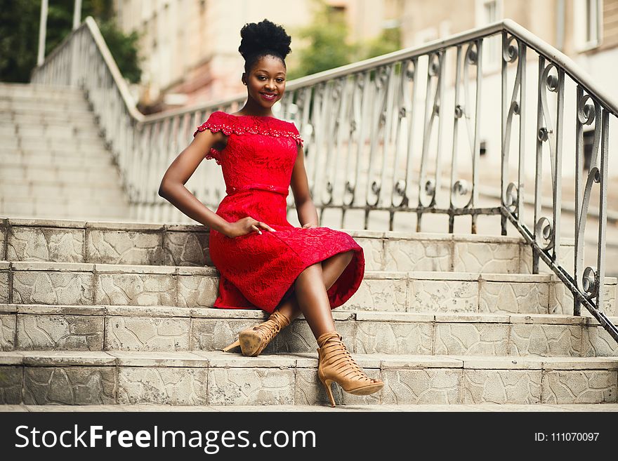 Woman in Red Off-shoulder Dress With Brown Leather High Heeled Gladiator Sandals on Brown Stairs
