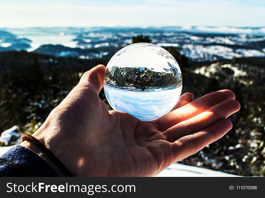 Photo of Person Holding Ball