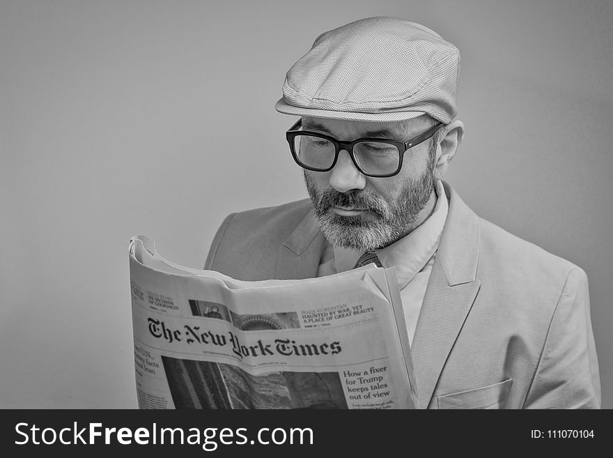 Man Reading a Newspaper