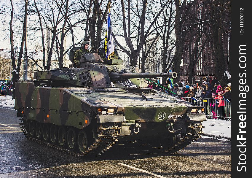 Black and Green Camouflage Military Tank Parade