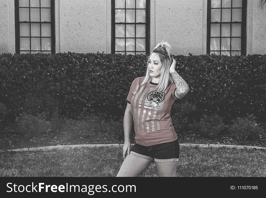 Woman Wearing Red Crew-neck Shirt With Black Short Shorts