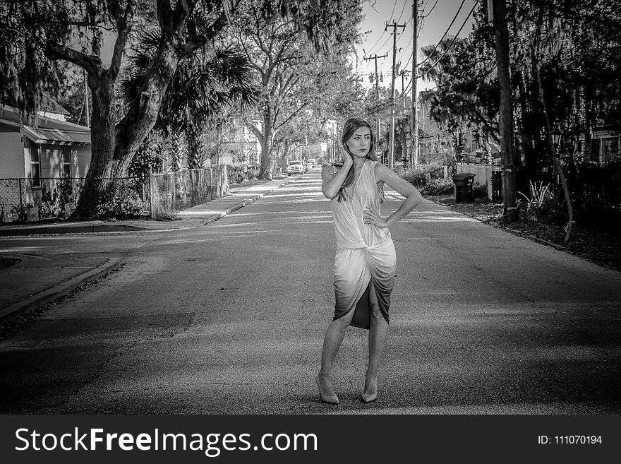 Woman Wearing Dress Standing On Center Of Road