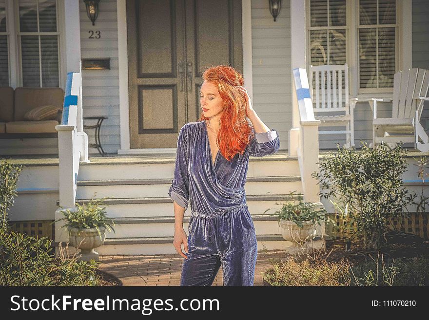 Red Haired Woman Wearing Blue Long-sleeve Jumpsuit