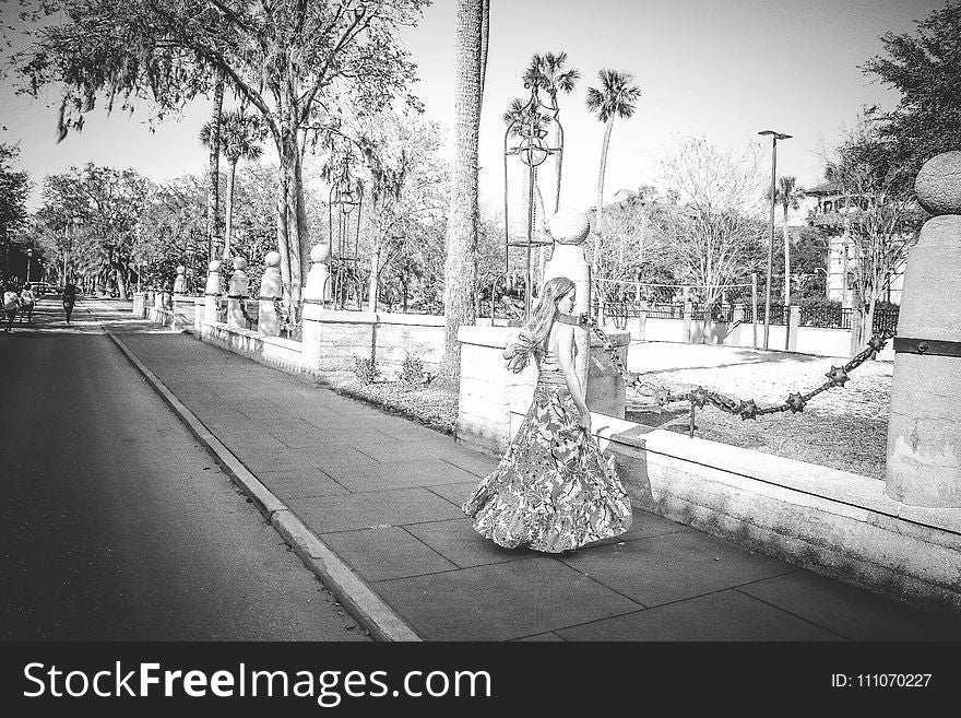 Grayscale Photo of Woman Wearing Dress