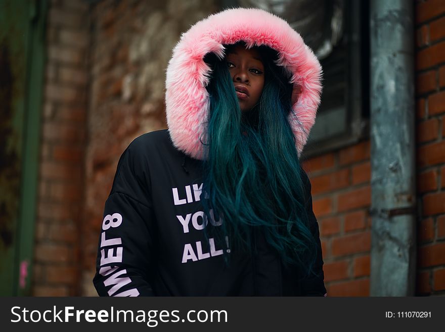 Shallow Focus Photography Woman in Black and Pink Parka Jacket