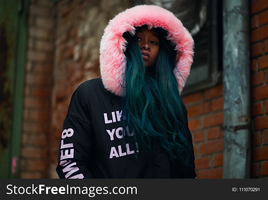 Shallow Focus Photography Woman In Black And Pink Parka Jacket