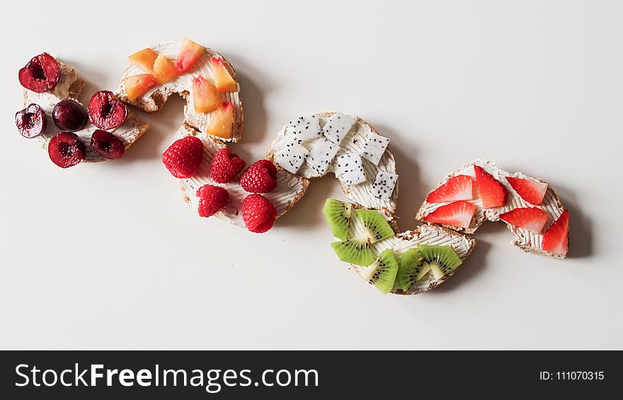 Assorted Sliced Fruit Lot on White Surface