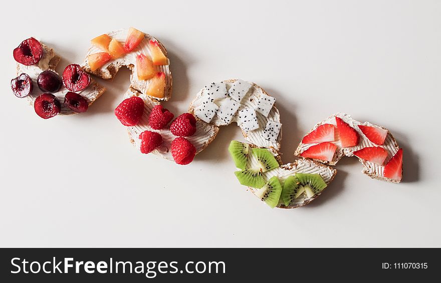 Assorted Sliced Fruit Lot On White Surface