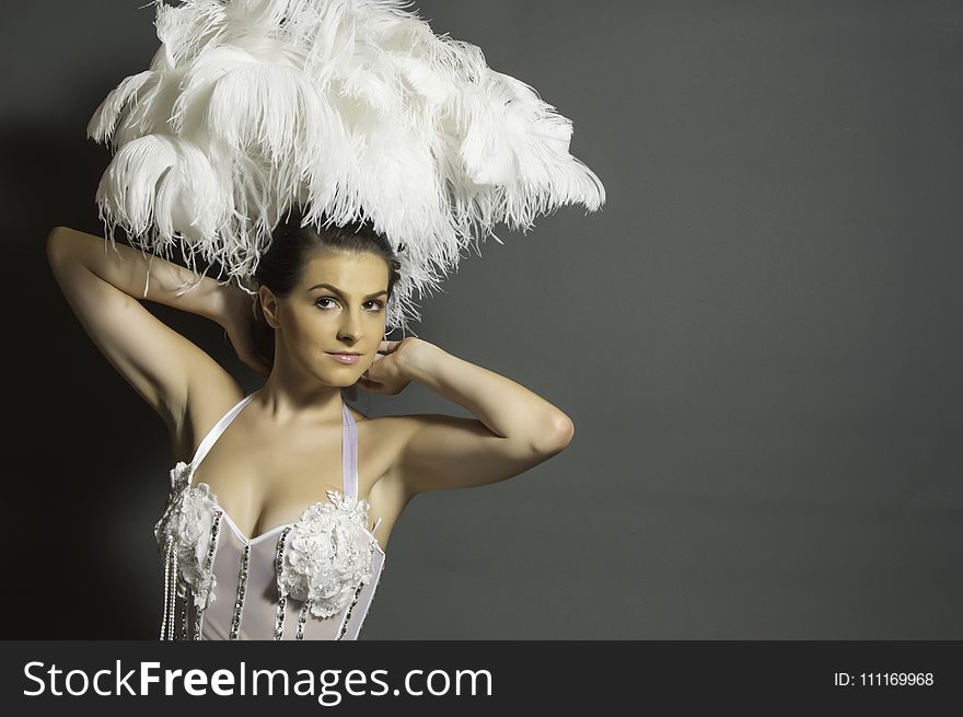Woman in White Headdress and White Mesh Top