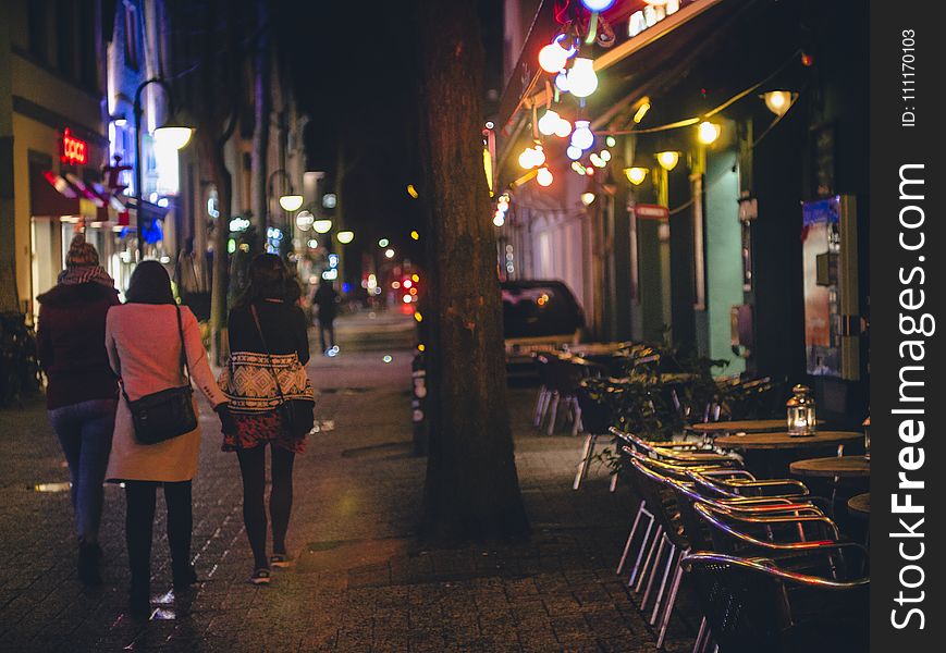 Three Women Walking During Nightime