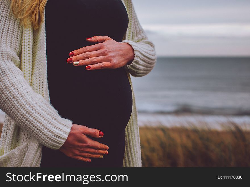 Woman Pregnant Standing Near Beach