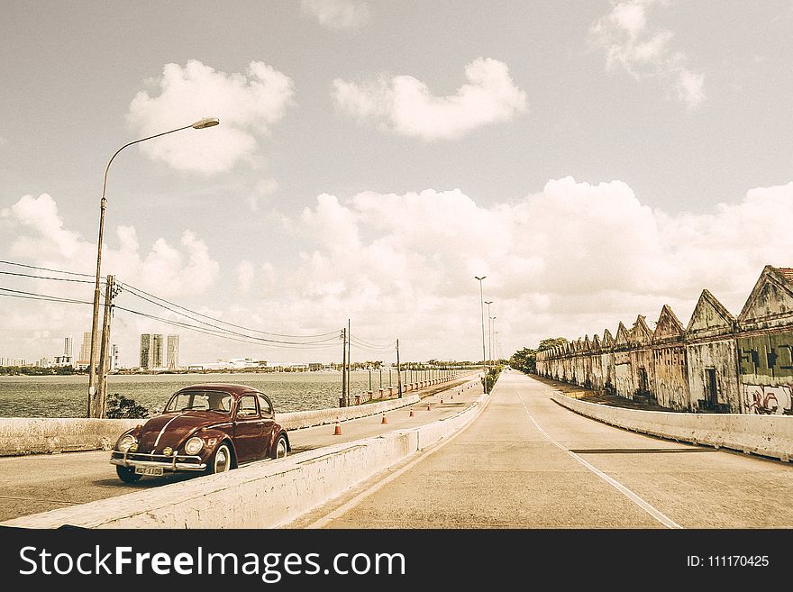 Brown Volkswagen Beetle On Asphalt Road