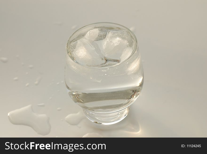 Water with ice in a glass. Water with ice in a glass