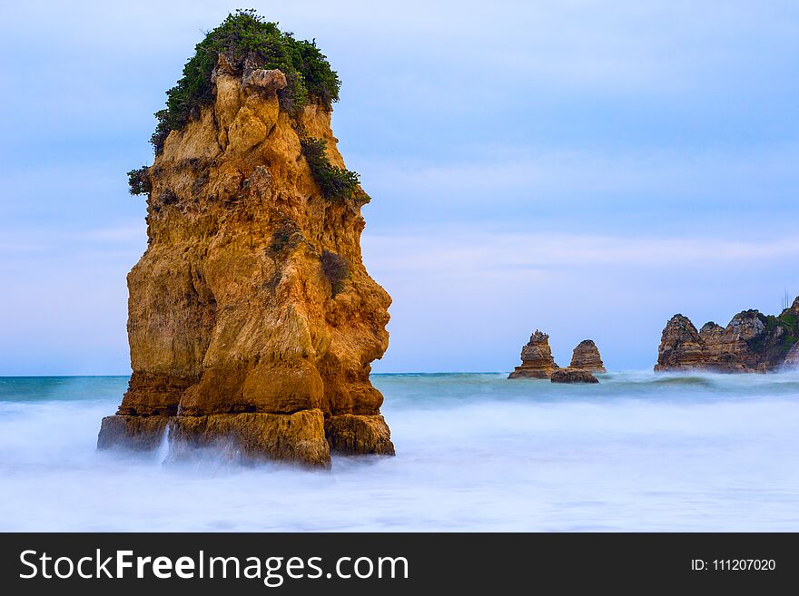 Rocky Cliffs Of Praia Dona Ana At Lagos, Portugal