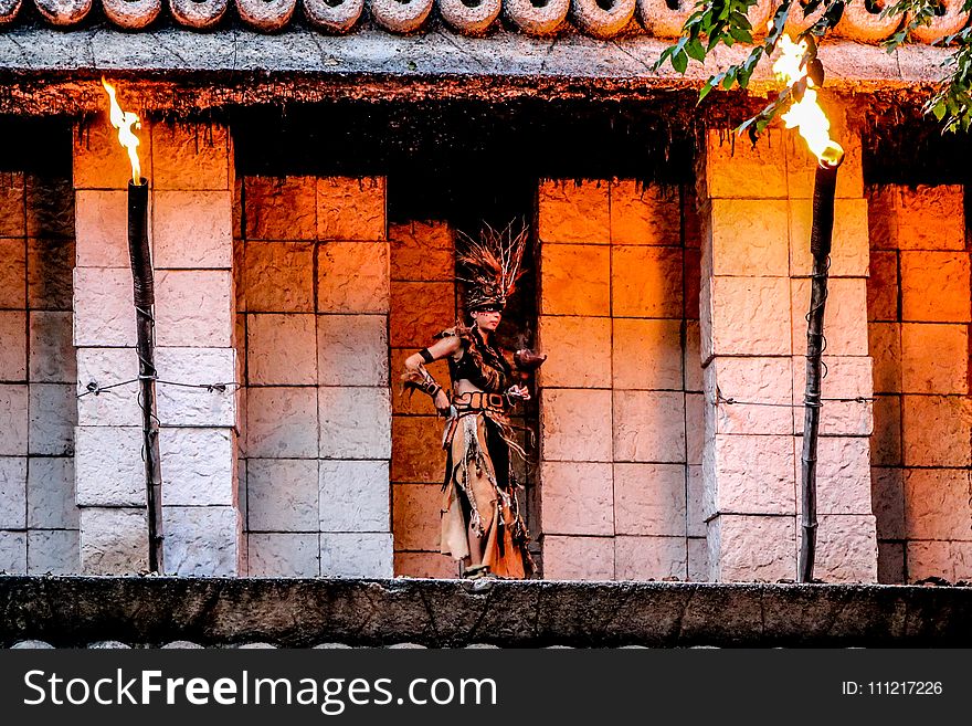 Woman Standing in Front of Gray Concrete Structure