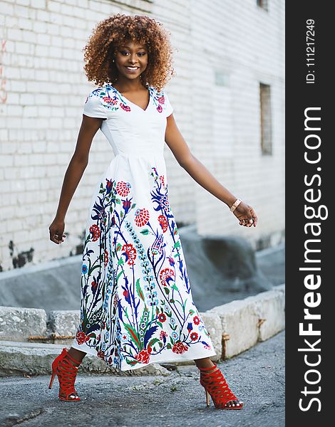 Woman Wearing White and Multicolored Floral V-neck Short-sleeved Maxi Dress