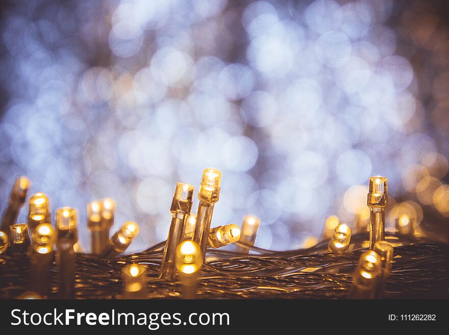 The nigt light bokeh festival with small LED light decor on party night christmas or new year background