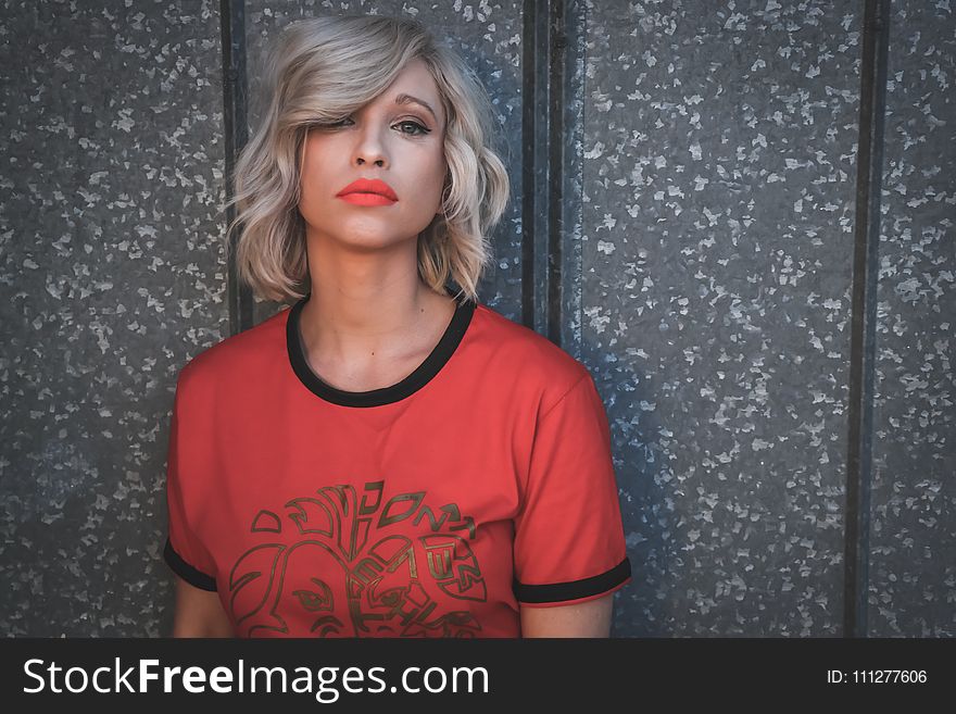 Woman Wearing Red Shirt on Gray Background