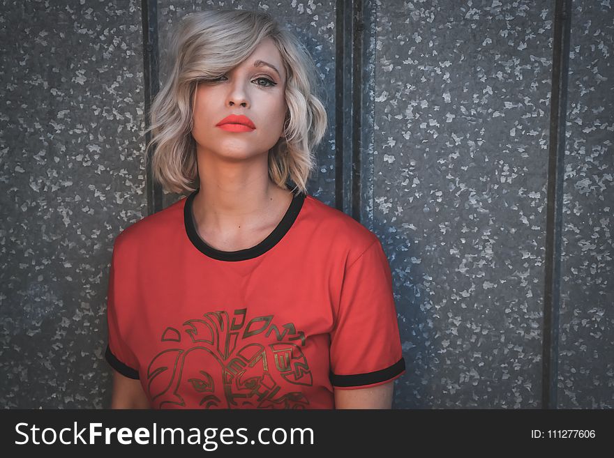 Woman Wearing Red Shirt On Gray Background