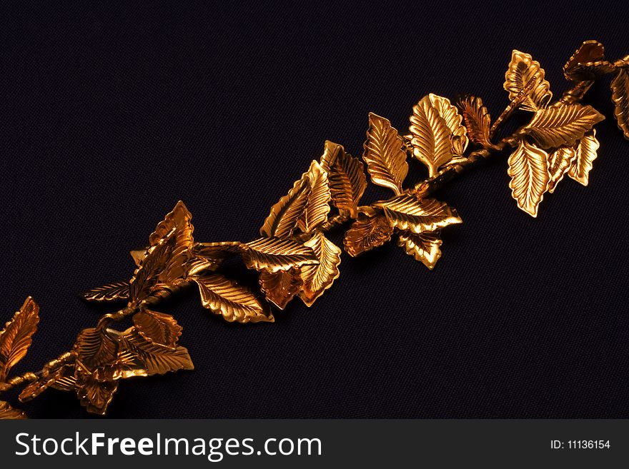 A macro picture of golden leaves on a chain. A macro picture of golden leaves on a chain