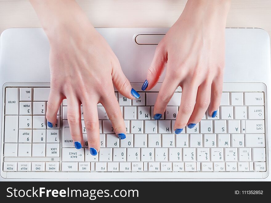 Female Hands Typing On White Laptop Keyboard