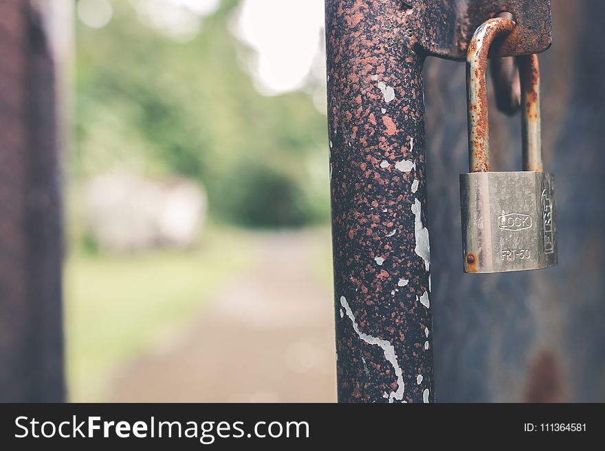 Rusted Grey Padlock in Selective-focus Photography