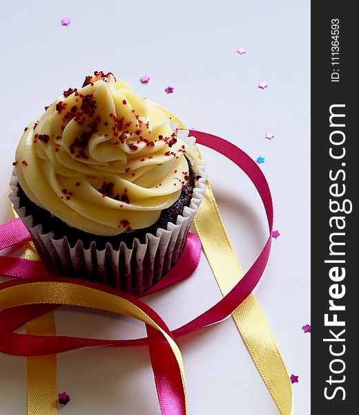 Chocolate Cupcake With White and Red Toppings