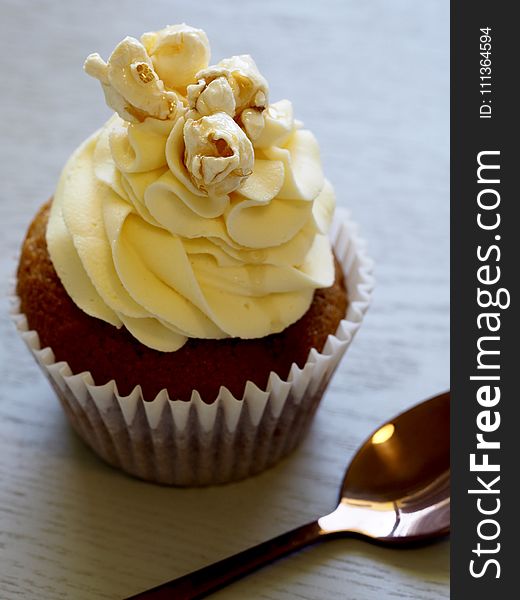 Chocolate Cupcake With Yellow Icing On Top