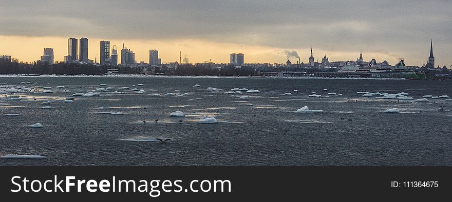 Cityscape Under Cloudy Sky