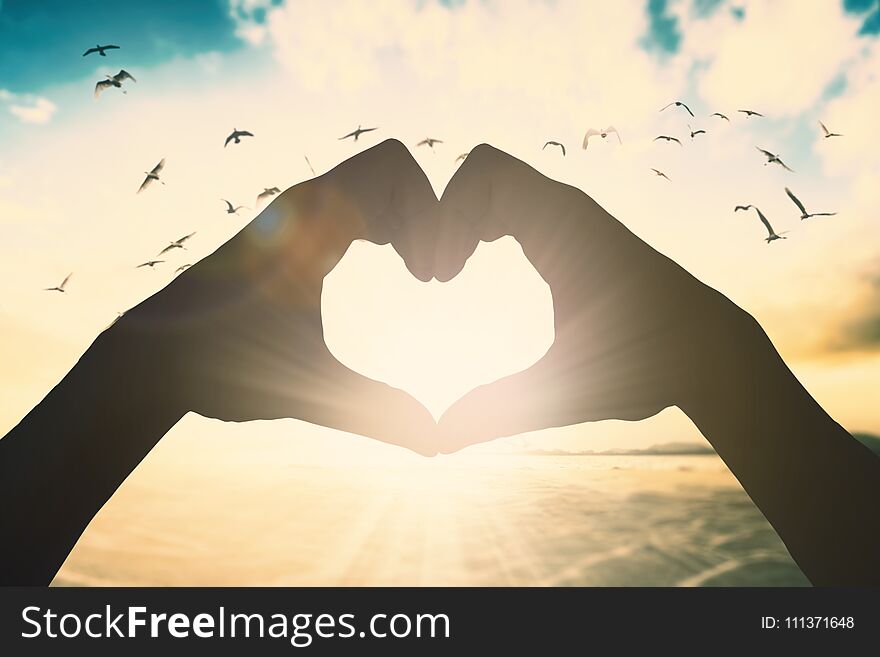 Hand love shape on beautiful background concept for relax lifestyle