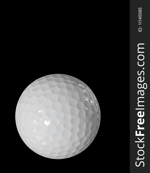 Golf Ball Isolated Against The Black Background.