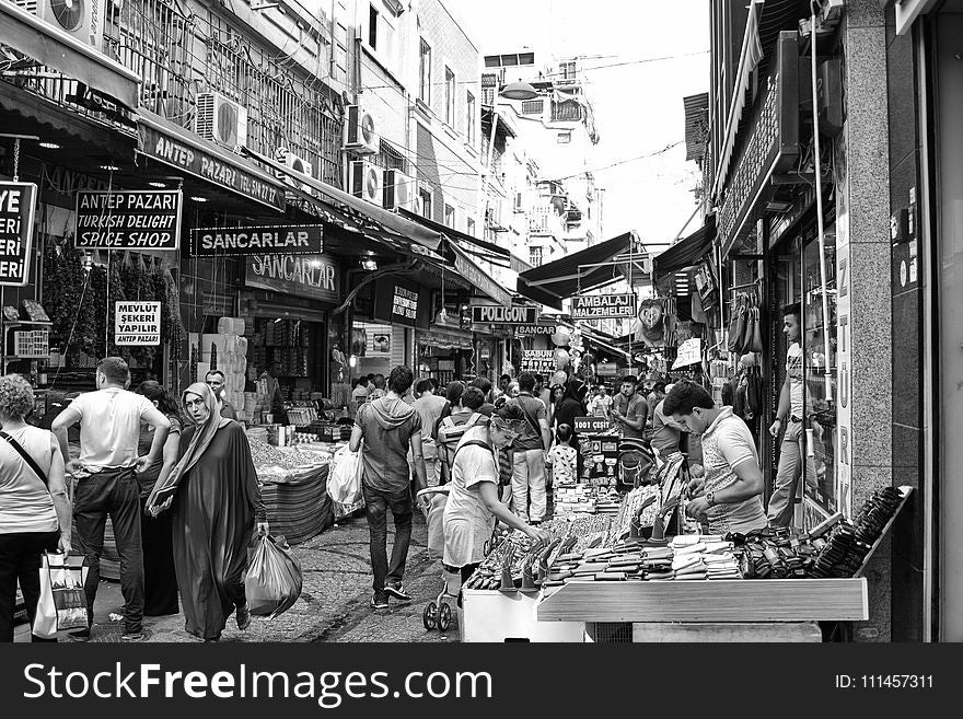 Grayscale Photo of People in the Market
