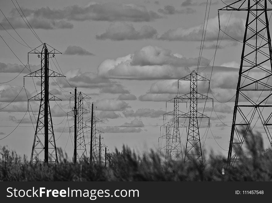 Grayscale Photo of Electricity Towers