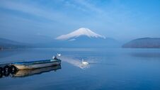A Small Boat At A Port With Morning Mist And FujiSan Royalty Free Stock Images