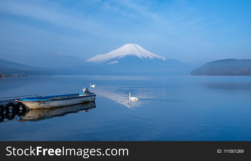 A Small Boat At A Port With Morning Mist And FujiSan