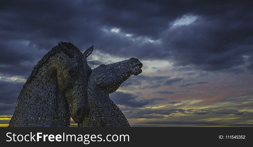 Two Grey Horse Statue Under Cloudy Sky