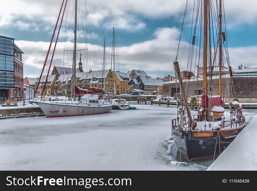 Sail Ships Near Concrete Boardwalk