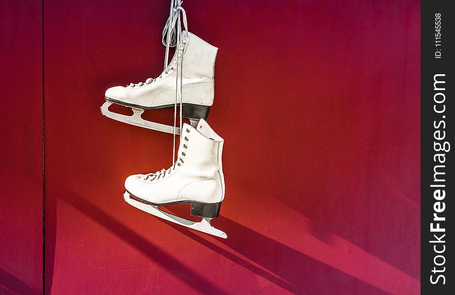 Hanged Pair of White Leather Figure Skates